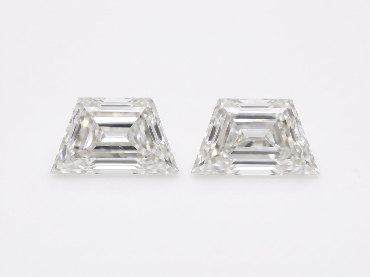 Two identical loose trapezoid diamonds side by side, a matched pair
